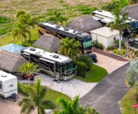 a group of rvs parked in a parking lot in Florida resort - RV Parks Under $500 a Month in Florida