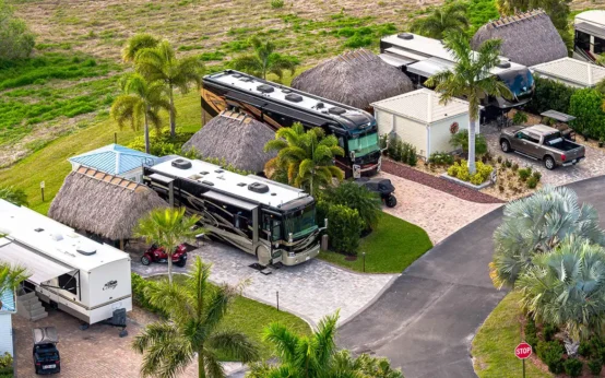 a group of rvs parked in a parking lot in Florida resort - RV Parks Under $500 a Month in Florida